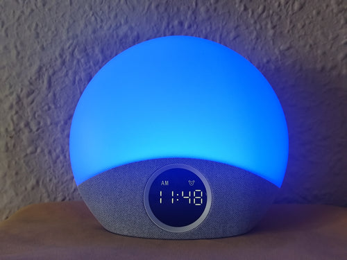 HarborHearth Sunrise Alarm Clock on a wooden bedside table — lifestyle photo